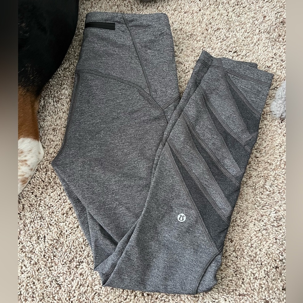 Lululemon- New without tags- high rise with mesh design at bottom- heather gray